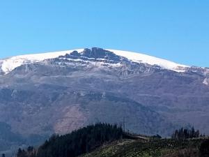 a mountain with snow on top of it at Errekaondo in Areatza