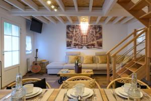 a living room with a couch and a table at Les Maisons de Maje - La Home45 in Honfleur