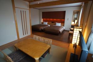 Postel nebo postele na pokoji v ubytování Asakusa Central Hotel