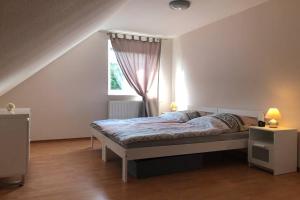 Katil atau katil-katil dalam bilik di Kur-Pur eine Ferienwohnung mit Sauna und Garten