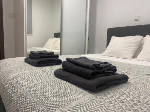 A bed or beds in a room at Luxury Lavender