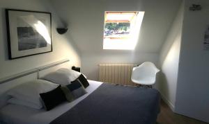 Cama ou camas em um quarto em Hotel De L'Europe