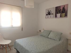 Кровать или кровати в номере Apartamento la Noria 2 Playa