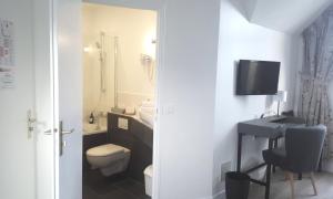 Um banheiro em Hotel De L'Europe
