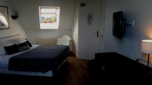 Cama ou camas em um quarto em Hotel De L'Europe