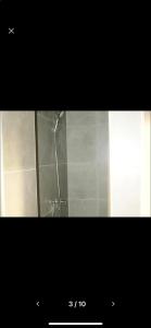 a picture of a shower in a bathroom at Appartement Studio Tournai in Tournai