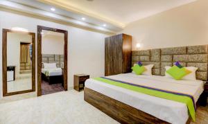 Postel nebo postele na pokoji v ubytování Hotel Bandhan Residency
