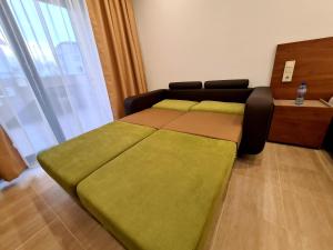 Postel nebo postele na pokoji v ubytování Family Hotel Serenity Palace