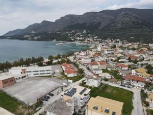 an aerial view of a town next to a body of water at Elenas Apartments in Plataria