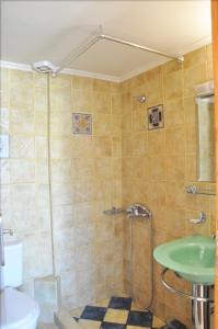 a bathroom with a shower and a sink at Villa Castellina & Emmanouela holiday apartment in Almyrida