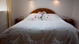 Hotel Los Laureles客房内的一张或多张床位