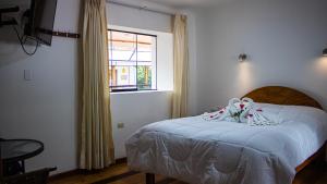 Hotel Los Laureles客房内的一张或多张床位