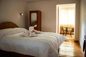 Hotel Los Laureles客房内的一张或多张床位
