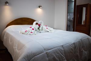 Hotel Los Laureles客房内的一张或多张床位