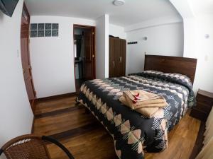 Hotel Los Laureles客房内的一张或多张床位