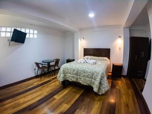 Hotel Los Laureles客房内的一张或多张床位