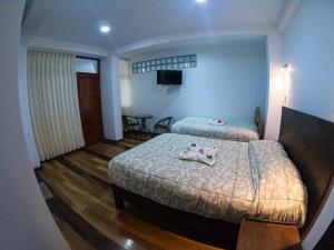 Hotel Los Laureles客房内的一张或多张床位