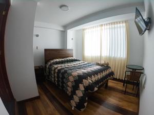 Hotel Los Laureles客房内的一张或多张床位