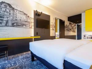 Postel nebo postele na pokoji v ubytování ibis Styles Basel City + 37 fotografií