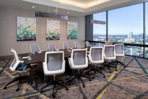 a conference room with a long table and chairs at Staybridge Suites Atlanta - Midtown by IHG in Atlanta