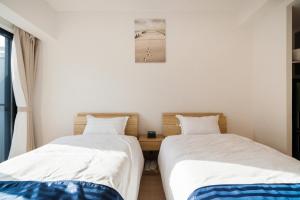 Postel nebo postele na pokoji v ubytování Hotel Emir