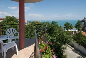 a balcony with a view of the ocean at Vromos Guest Rooms in Chernomorets