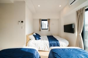Postel nebo postele na pokoji v ubytování Hotel Emir