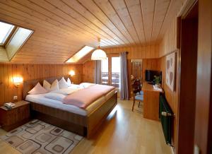 En eller flere senge i et værelse på Chalet Sonne Vandans