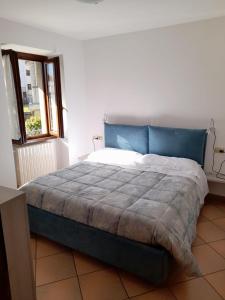A bed or beds in a room at Accogliente struttura nel cuore della Valmalenco