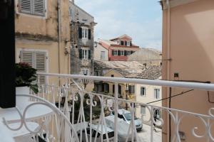 a balcony with a view of buildings at La Cantada - Renovated apartment in Corfu town in Corfu