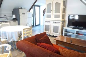 Kuchyň nebo kuchyňský kout v ubytování Appartement dans un ancien corp de ferme