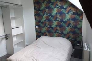 Postel nebo postele na pokoji v ubytování Appartement dans un ancien corp de ferme