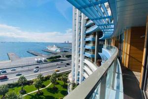 a balcony of a building with a view of the ocean at Lux 2 Room Suite Apartment With Seaview In Center in Istanbul