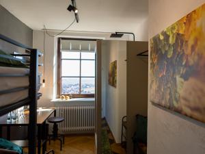 a room with a painting on the wall and a window at Hotel Zum Burggraf in Neuleiningen