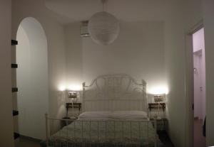 Postel nebo postele na pokoji v ubytování B&B Casa Cantoniera