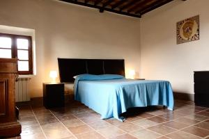 Postel nebo postele na pokoji v ubytování Casa alla Vecchia Posta di Bagno Vignoni