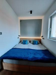 Postel nebo postele na pokoji v ubytování Molo Wellness Apartmanok