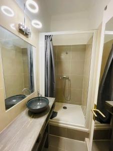 a bathroom with a sink and a shower at San Lazaro in Ajaccio