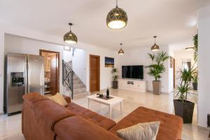 Televiisor ja/või meelelahutuskeskus majutusasutuses Villa Aria