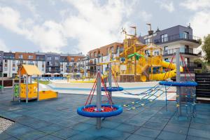 a childrens playground with a slide and a water park at Bel Mare Resort Apartament 417 in Międzyzdroje