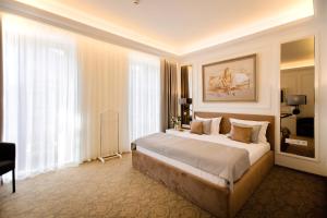Postel nebo postele na pokoji v ubytování Bon Hotel + 37 fotografií