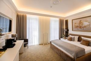 Postel nebo postele na pokoji v ubytování Bon Hotel