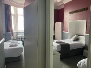 Кровать или кровати в номере Catania