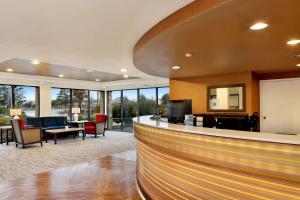 a lobby with a bar with chairs and tables at Comfort Inn Bellingham in Bellingham