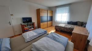En eller flere senger på et rom på Appartement Wagner