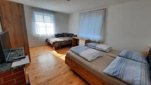 En eller flere senger på et rom på Appartement Wagner