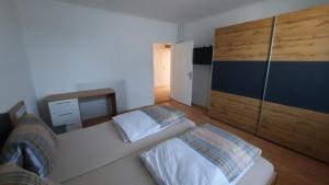 En eller flere senger på et rom på Appartement Wagner