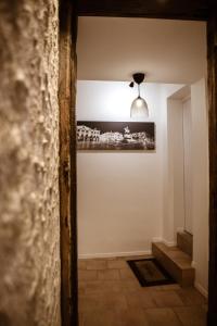 a hallway with a pendant light in a house at Au Bourg Neuf in Orléans