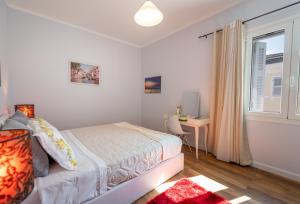 A bed or beds in a room at Jordi apartment