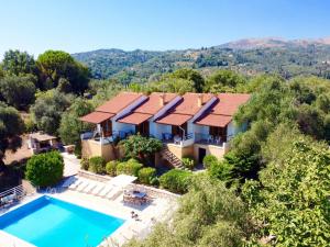 an aerial view of a house with a swimming pool at Villa Marialetta St Stephanos with private pool by DadoVillas in Agnítsini